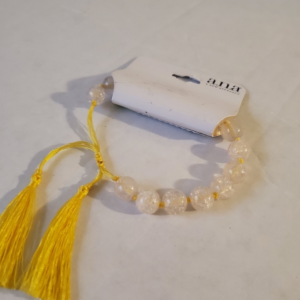 Beaded bracelet w cord adjustment & yellow tassel